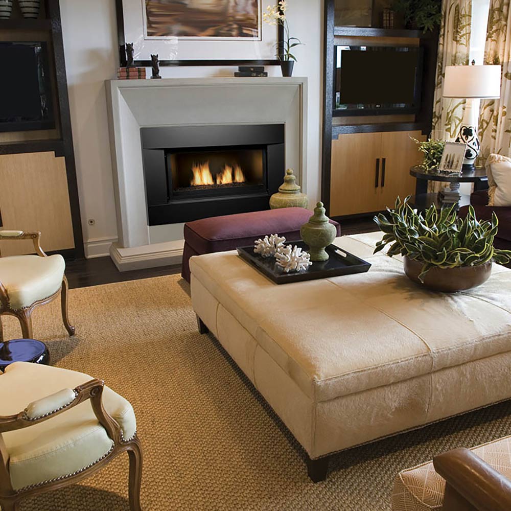 Built-in gas fireplace with black firebox and burning flames in a white mantel