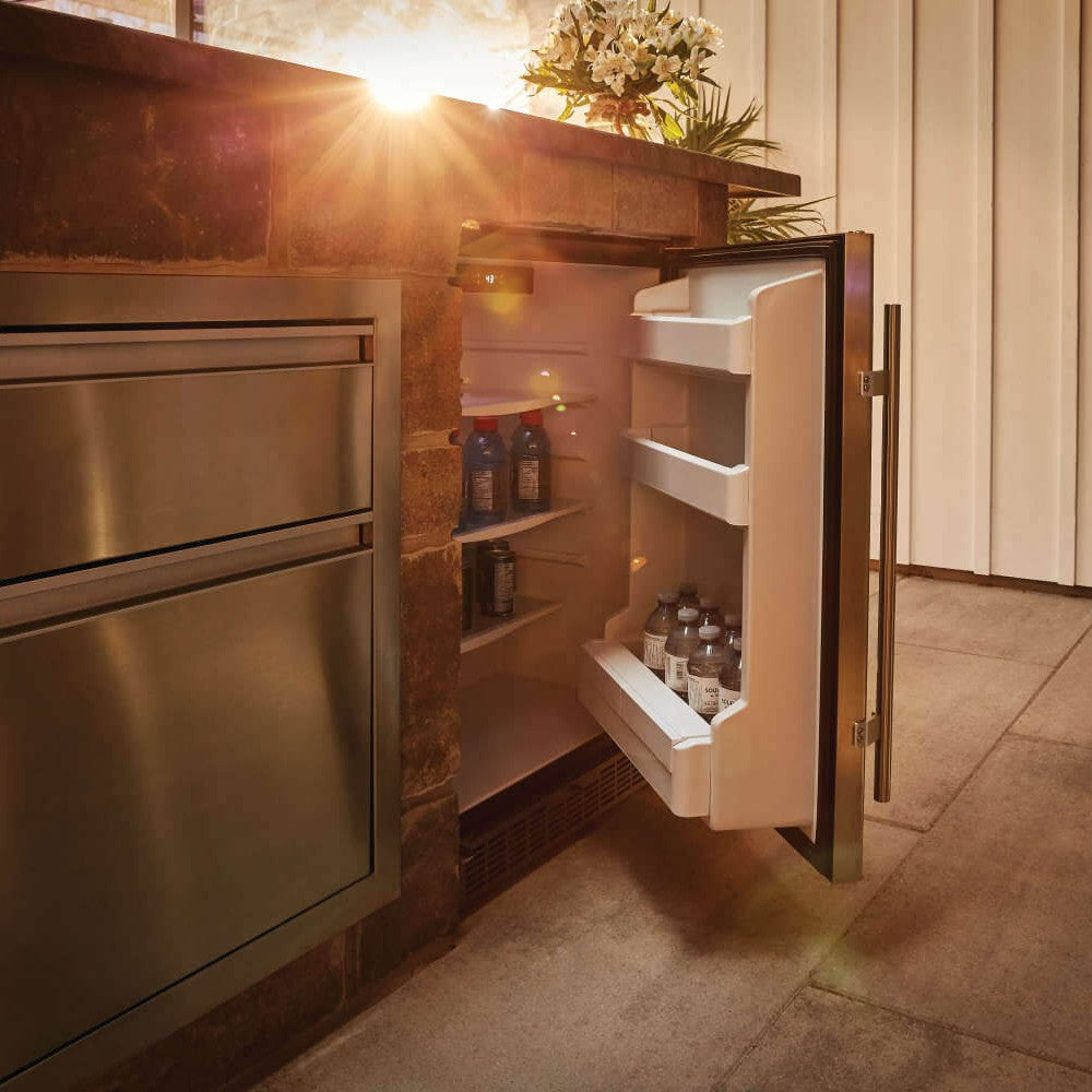 Outdoor stainless steel refrigerator with open door showing white interior shelves