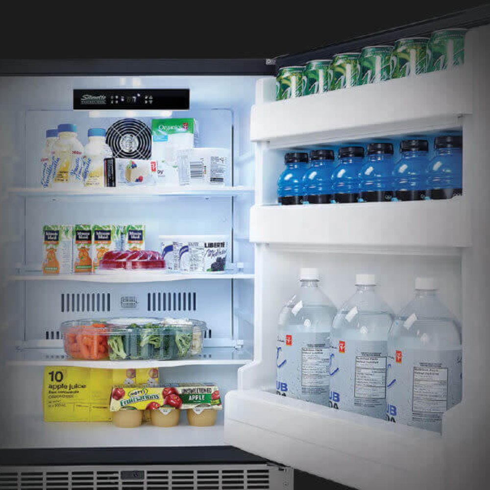 Refrigerator interior with clear shelves, bottles, and containers in white door