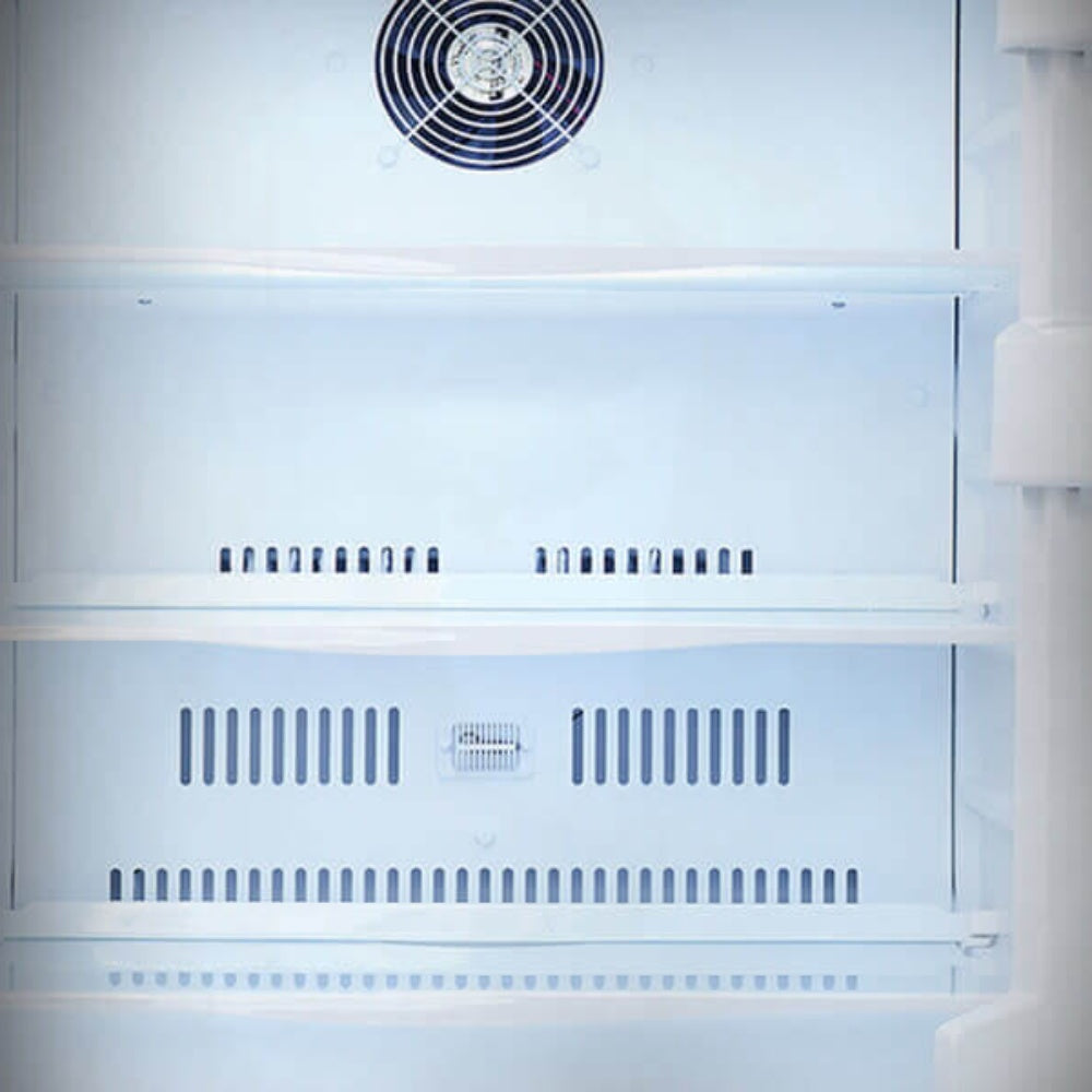 Refrigerator interior with fan grille and vented shelves, white back and sidewalls