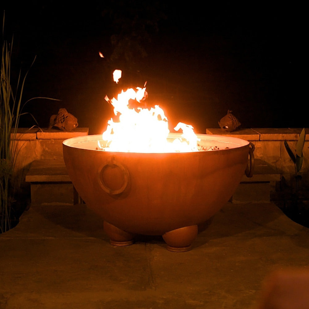 Gas fire pit bowl with flames, round side air port, burning logs visible