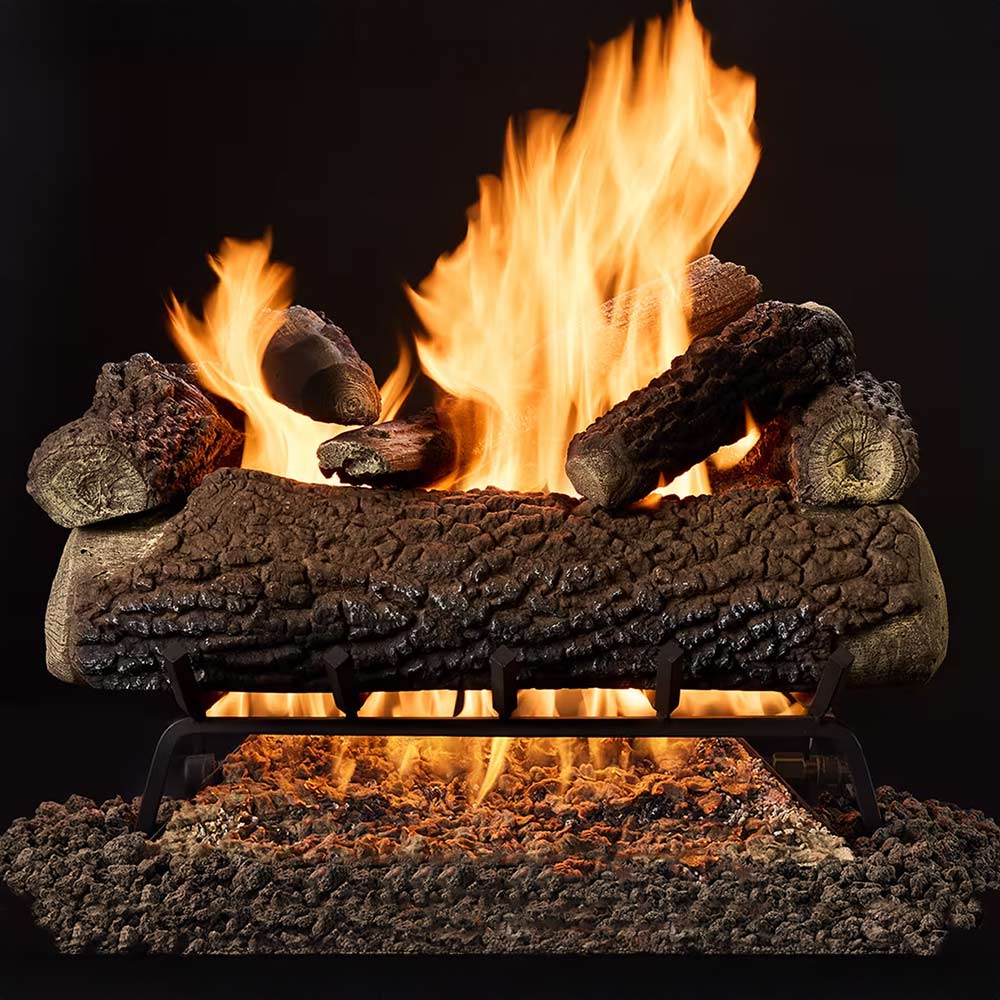 Indoor gas log set with burning oak-style logs and glowing ember bed