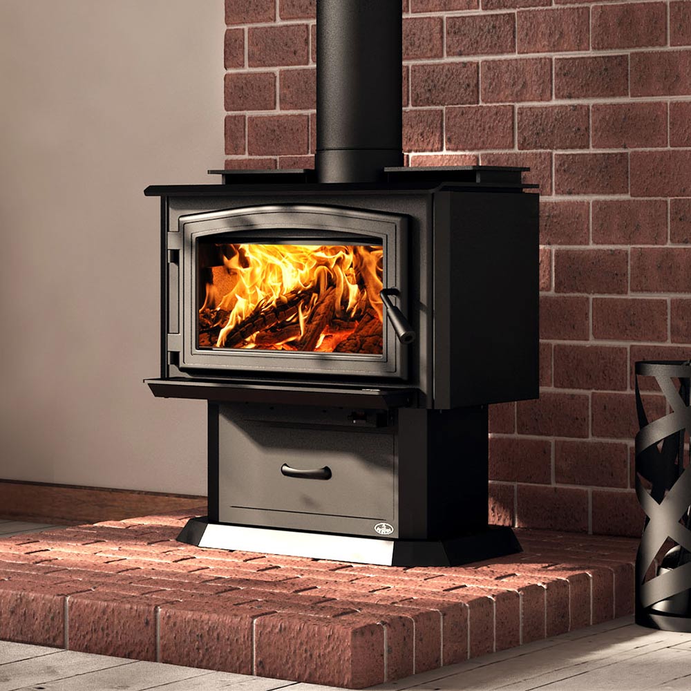 Black wood stove with glass door, swing handle, and ash drawer beneath.
