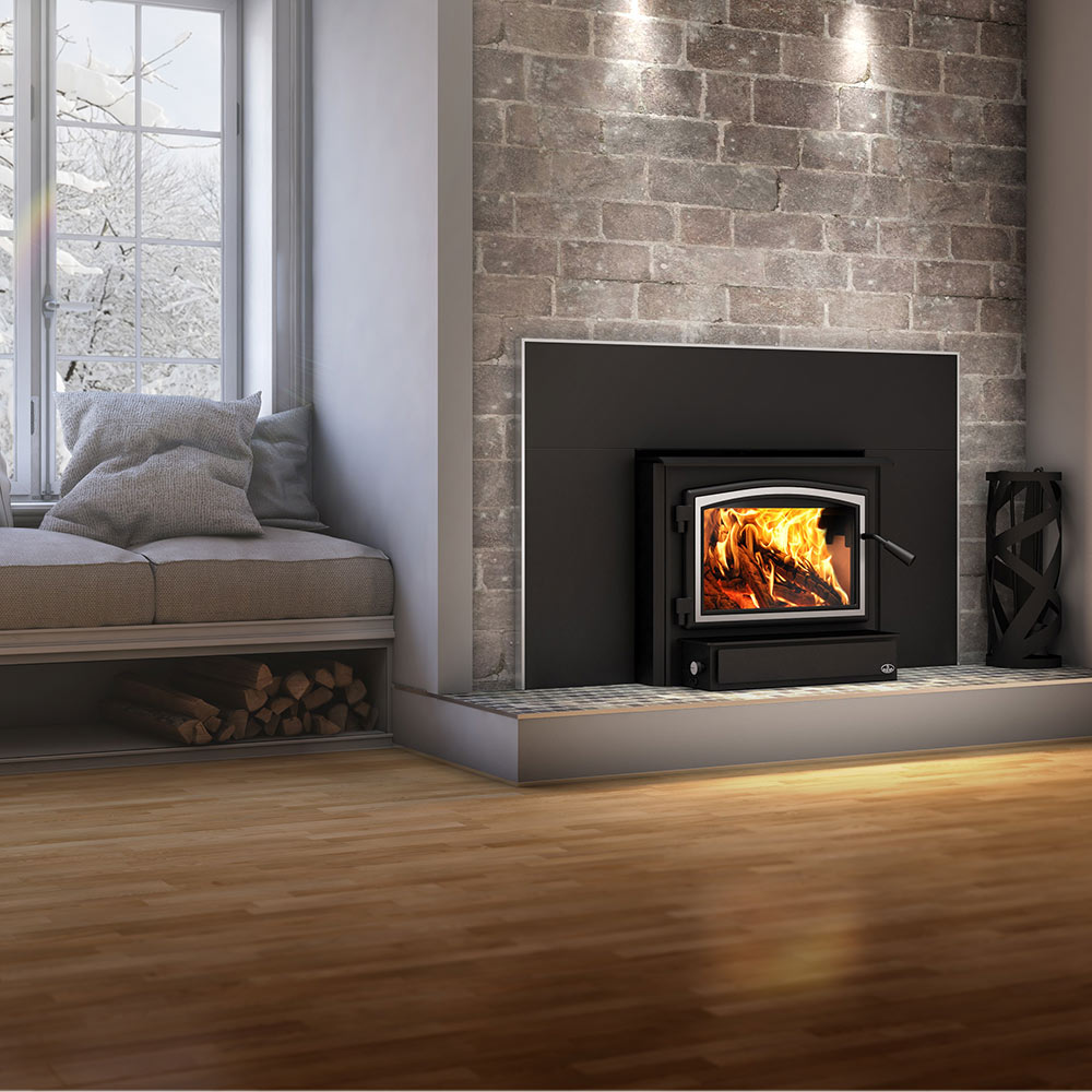 Black wood-burning stove insert with lit firebox and side handle