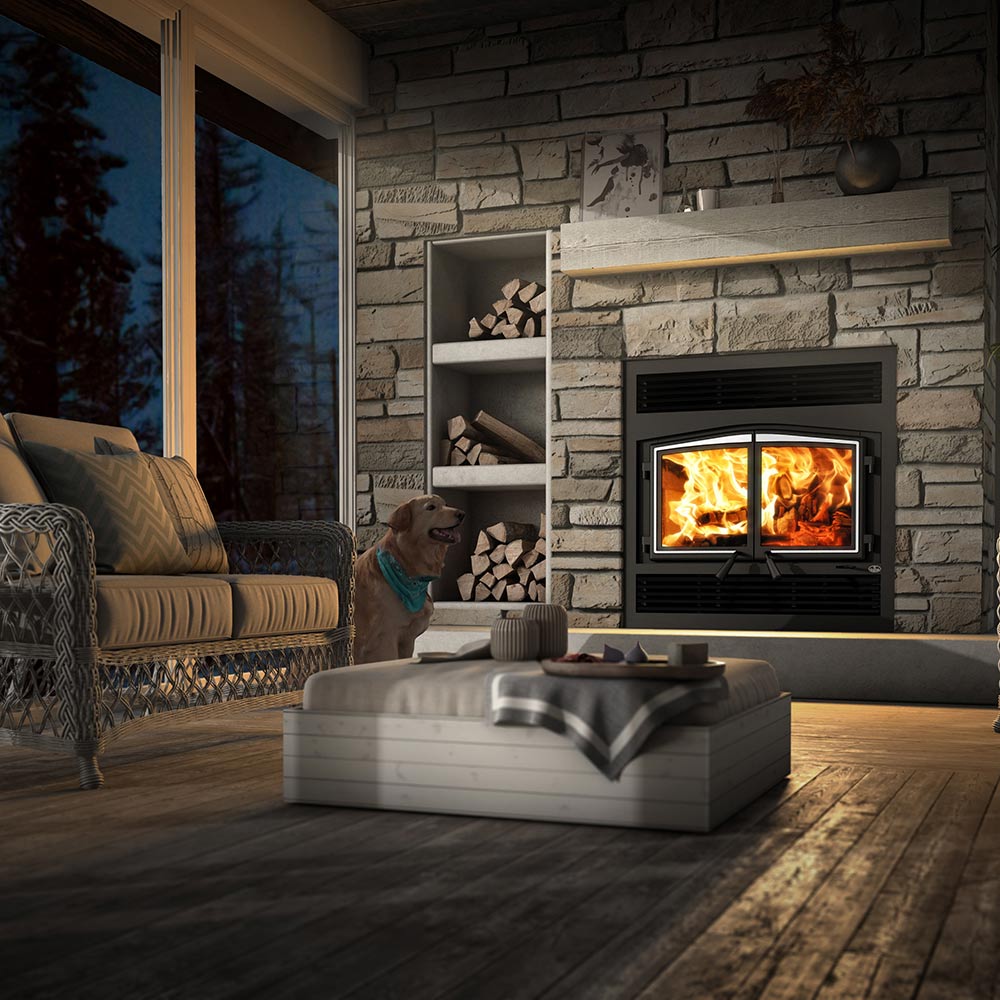 Wood fireplace with glass doors, dark surround, split flame view with burning logs visible