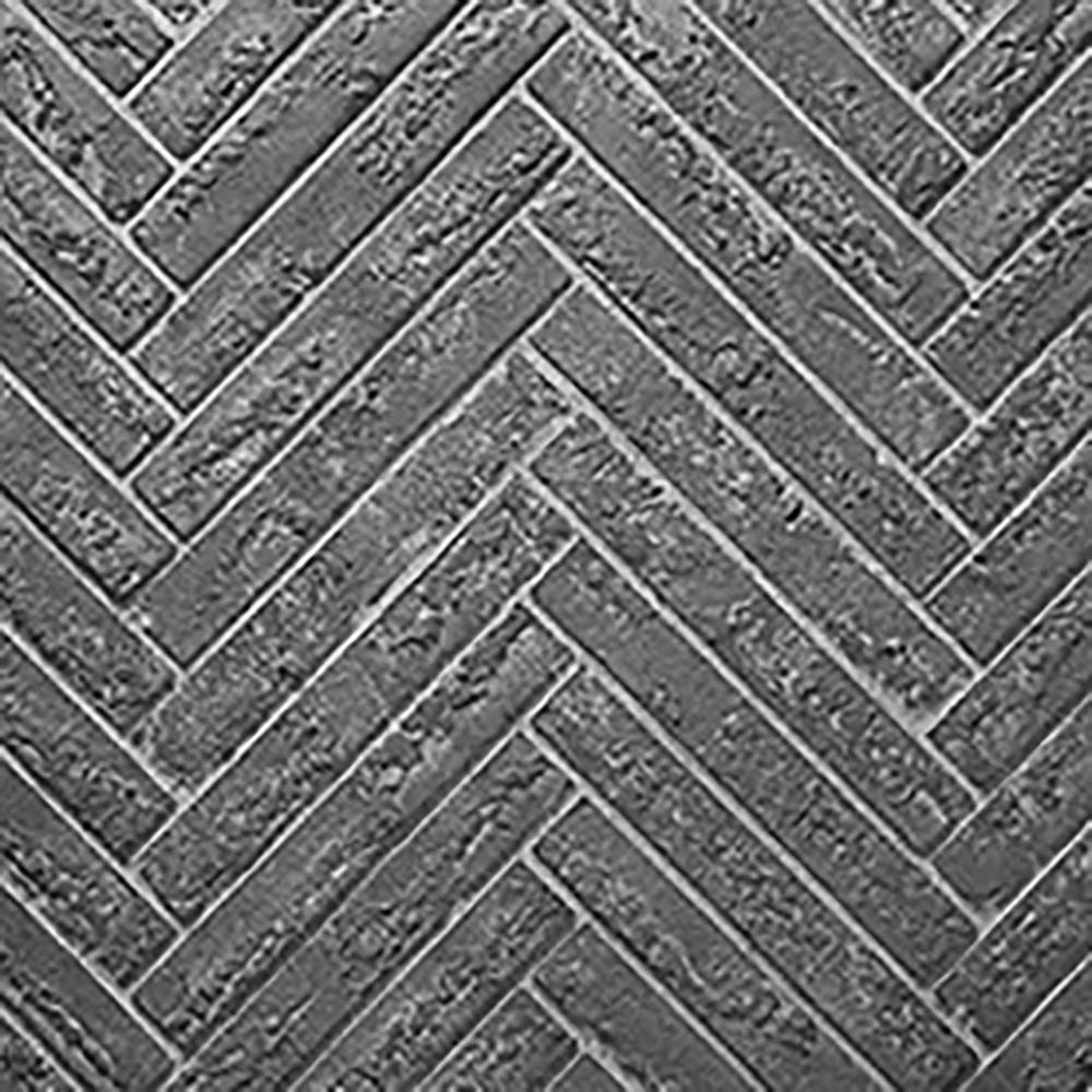 Grey herringbone refractory fireplace panel with textured zigzag tile pattern