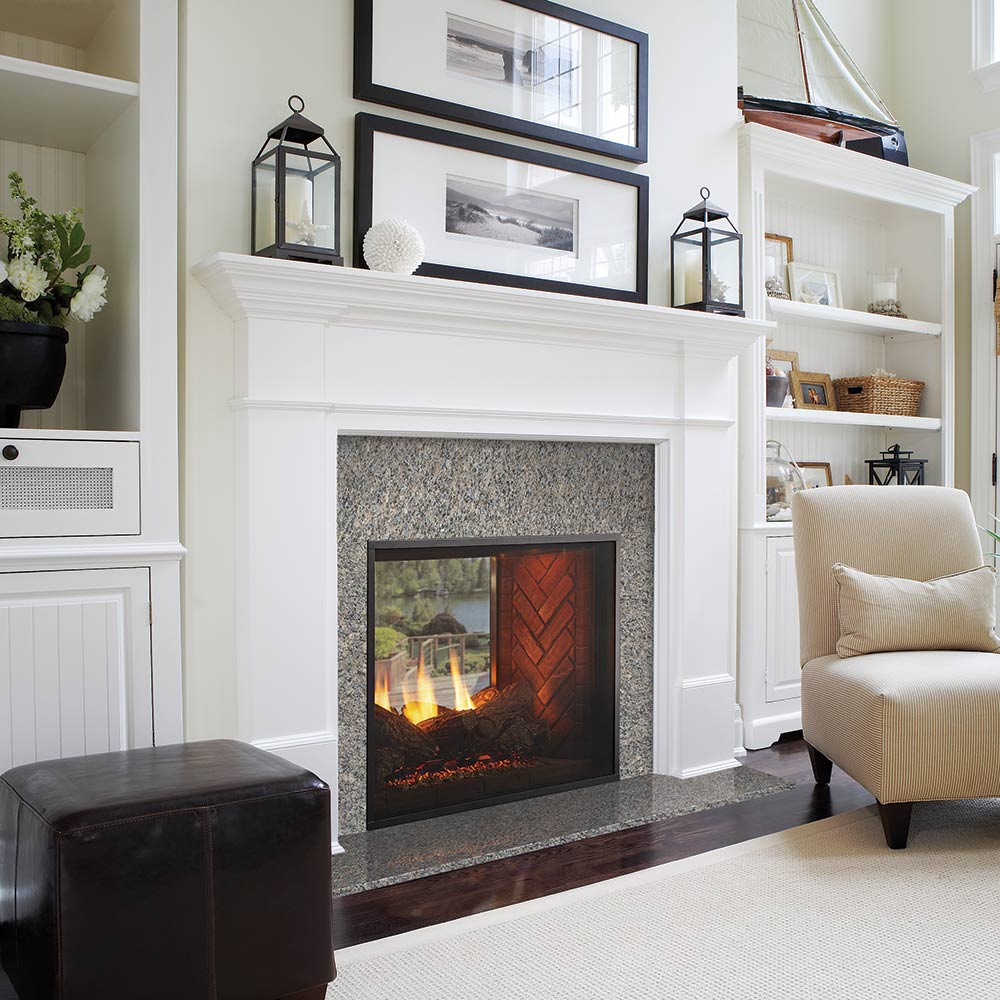 Indoor gas fireplace with gray surround and red brick see-through firebox