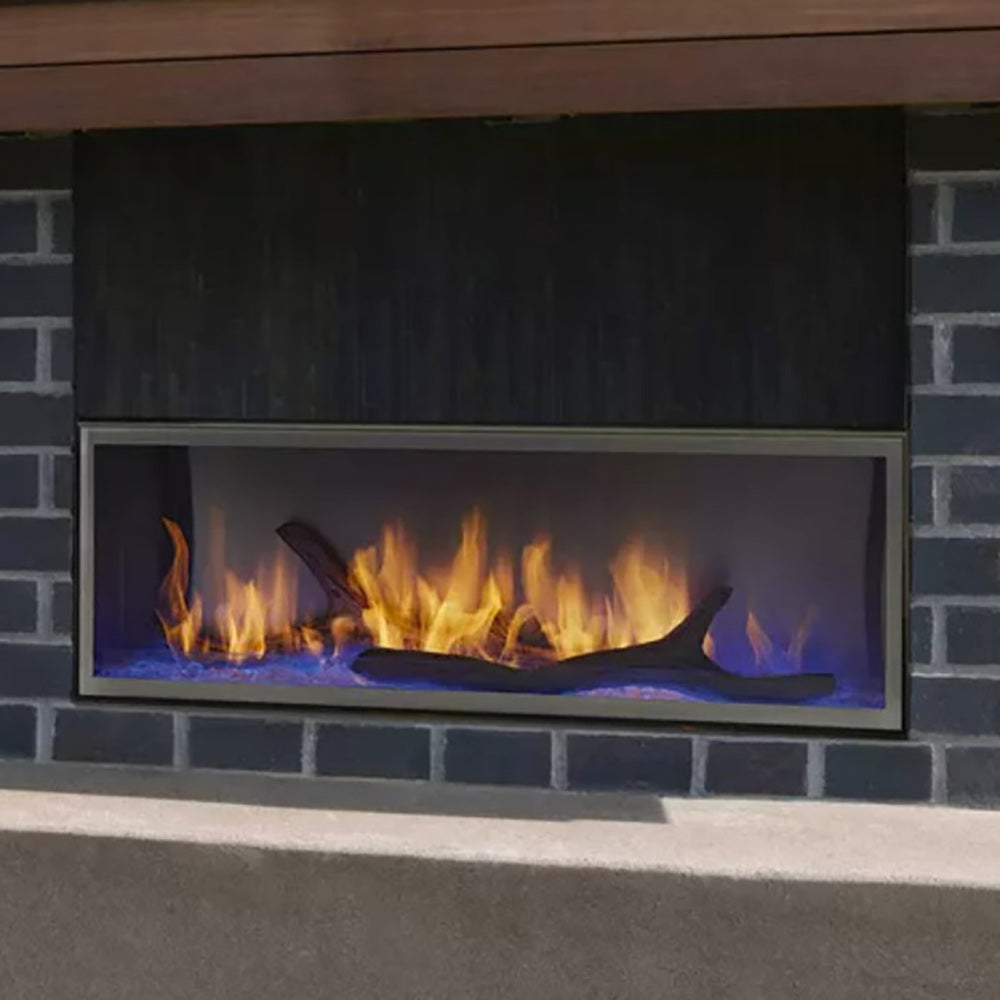 Outdoor gas fireplace face trim with black surround and silver frame, visible burner opening
