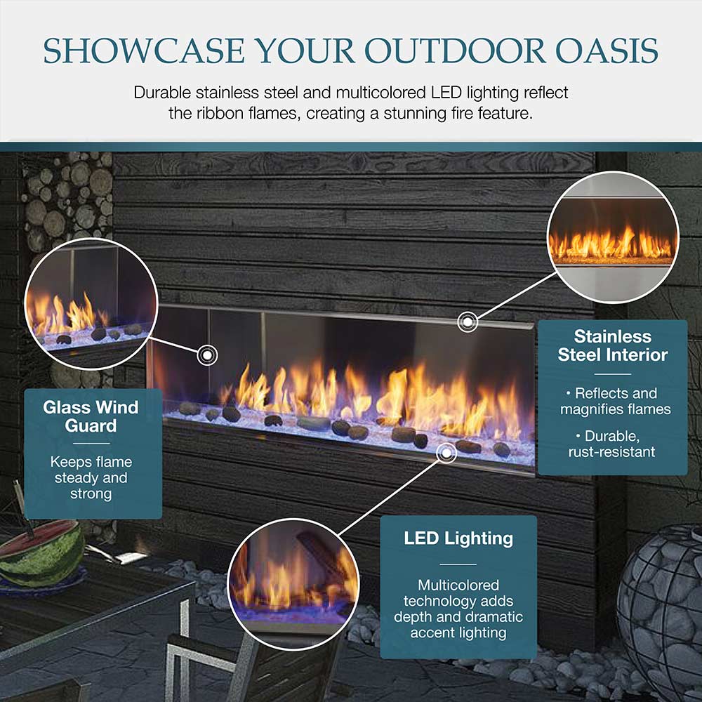 Outdoor linear gas fireplace with glass wind guard and glowing flames