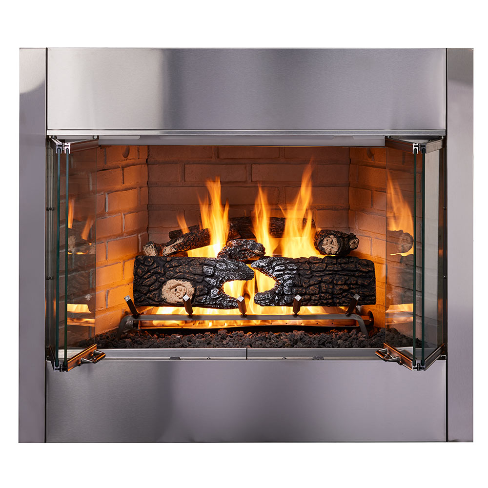 Outdoor wood-burning fireplace with tall open doors, brick interior, burning logs inside