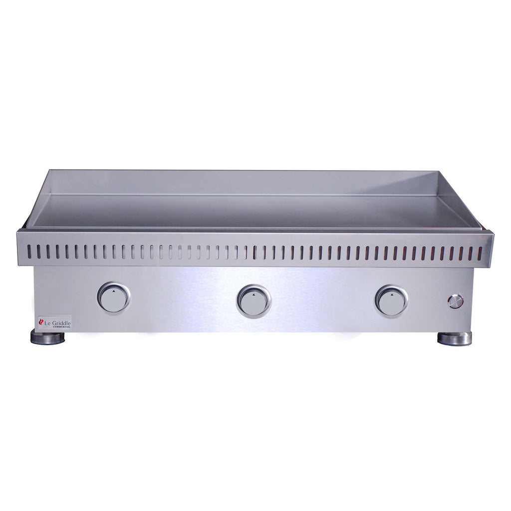 Stainless steel built-in gas griddle front panel with three knobs and right-side valve