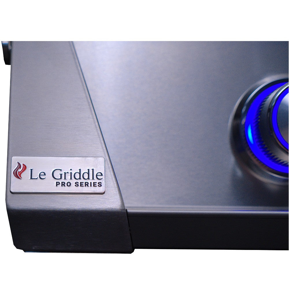Stainless steel griddle corner with Le Griddle Pro Series logo and blue burner