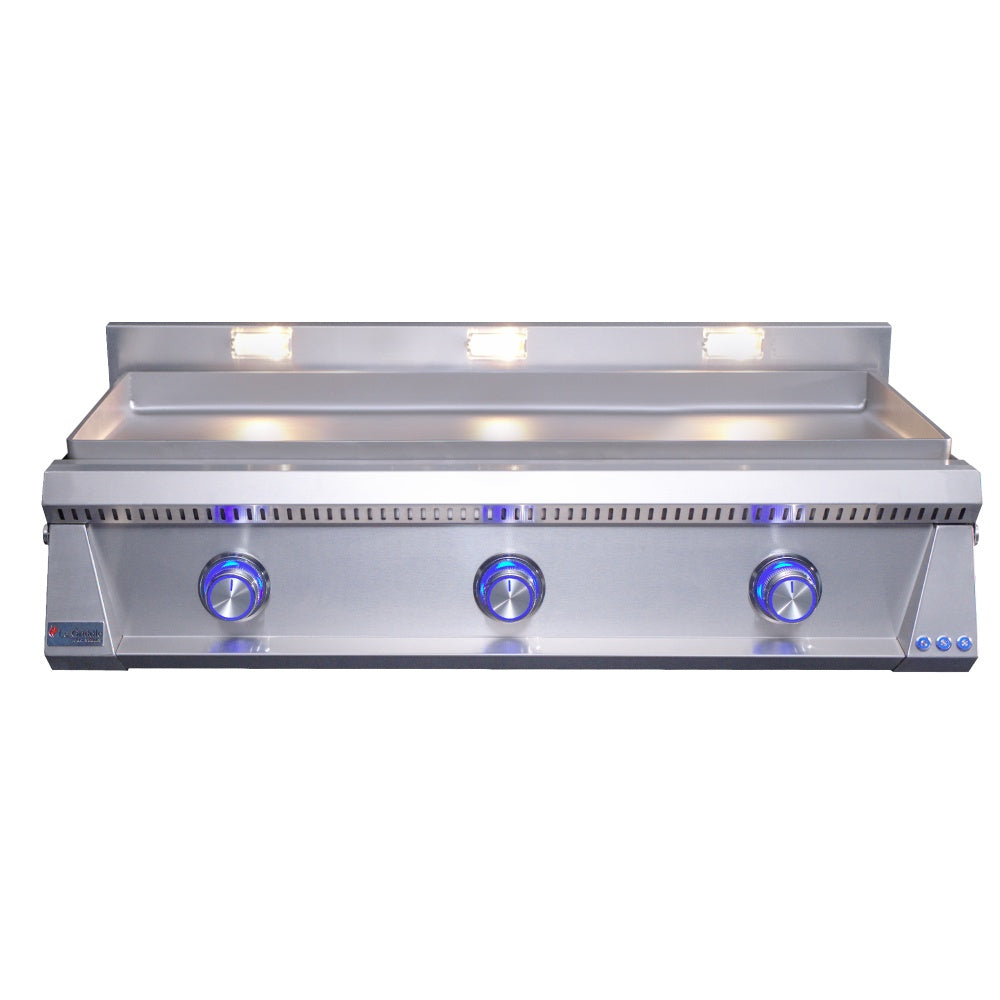 Stainless steel built-in gas griddle with three blue control knobs and lit burners