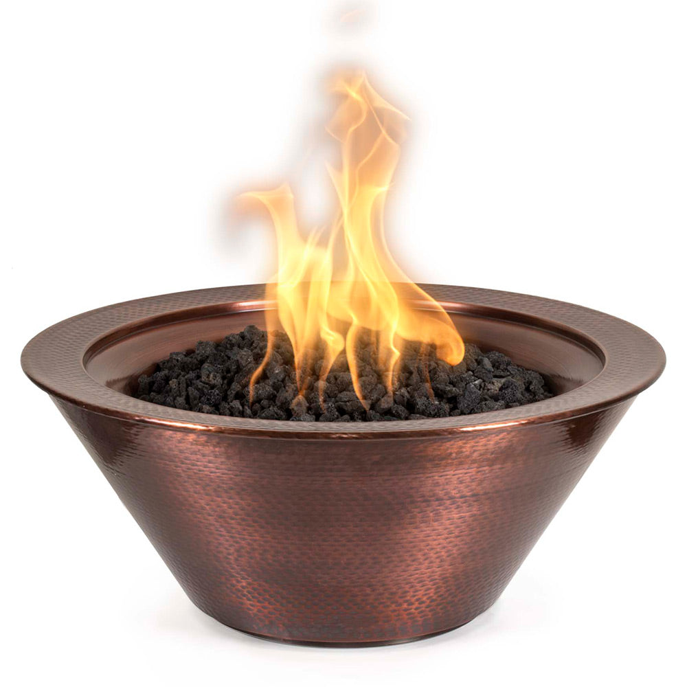 Round copper gas fire bowl with visible flames and black fire rocks