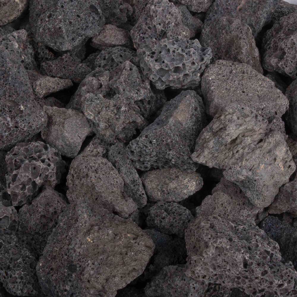 Volcanic lava rock, dark gray-black stones in a pile