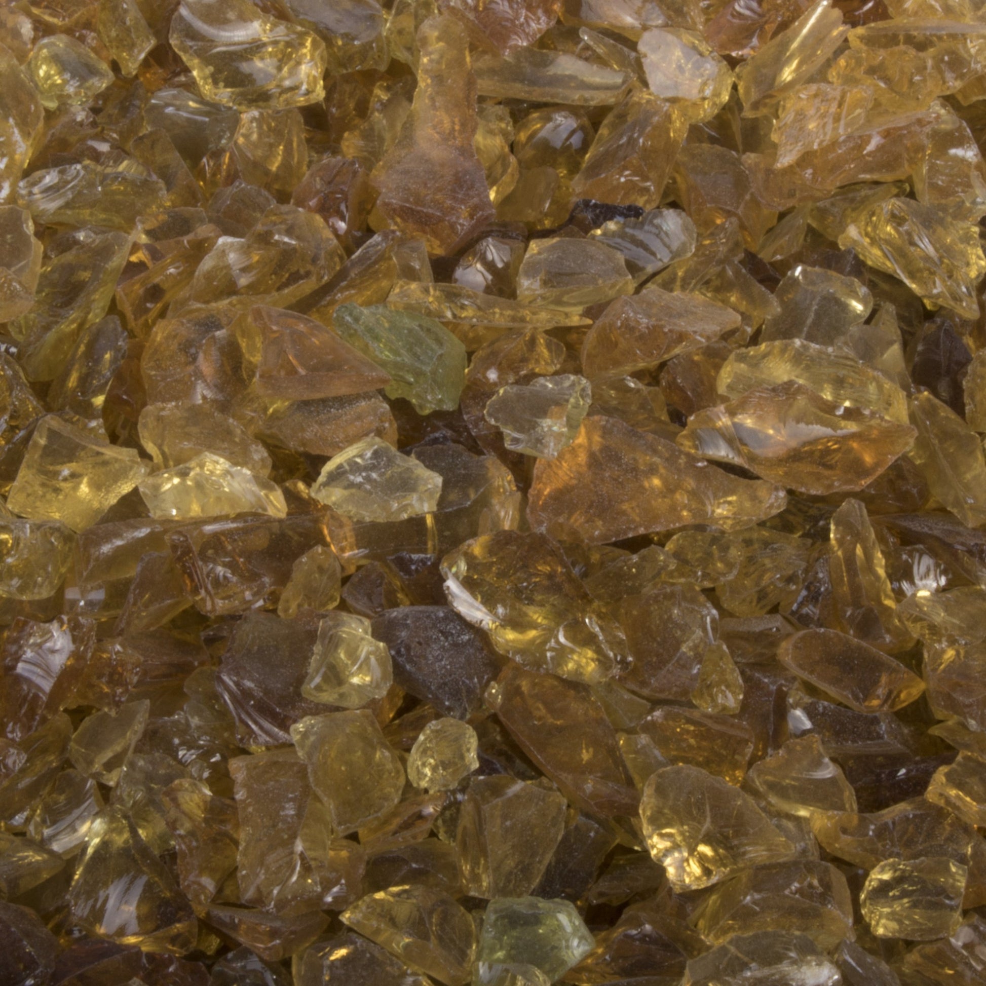 Amber fire glass chunks in varied sizes, translucent golden-brown pieces