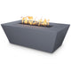Linear concrete gas fire pit in dark blue-gray with flames, rectangular open top and angled view.