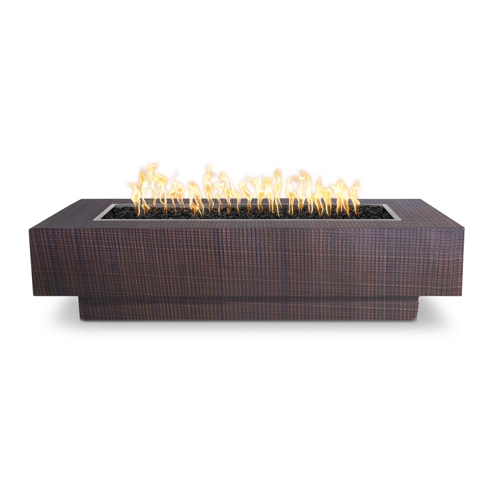 Rectangular gas fire pit with burning flames in a dark copper-toned liner