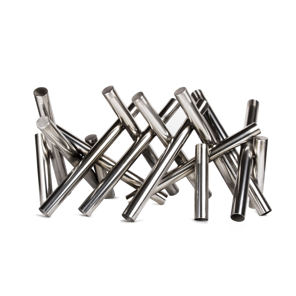 Polished stainless steel fire log set of metallic cylinders, standing in a cluster