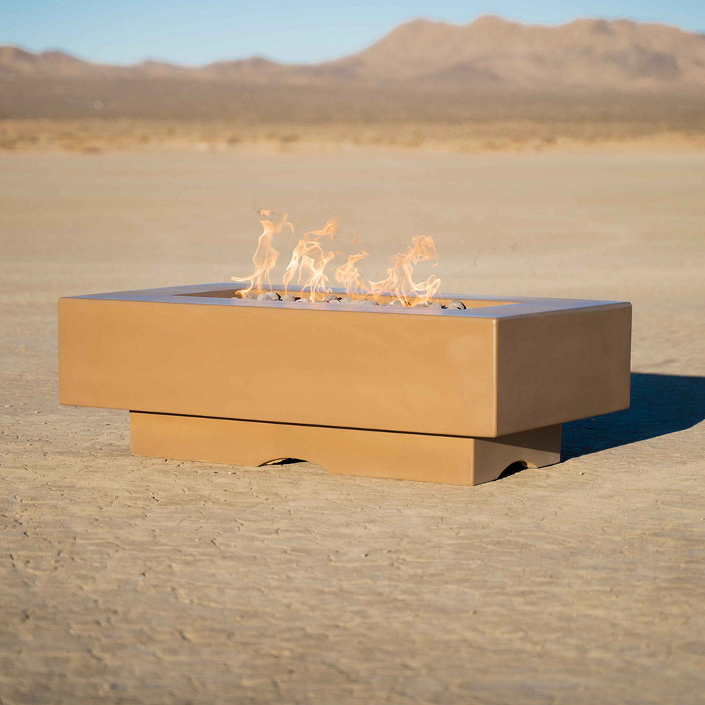 Tan linear concrete gas fire pit with visible flames inside the rectangular burner.