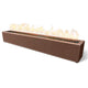 Brown speckled linear gas fire pit with flames in the top burner channel