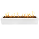 White rectangular linear gas fire pit with flames along the burner bed
