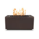 Gas fire pit with brown speckled rectangular body and flames in burner opening