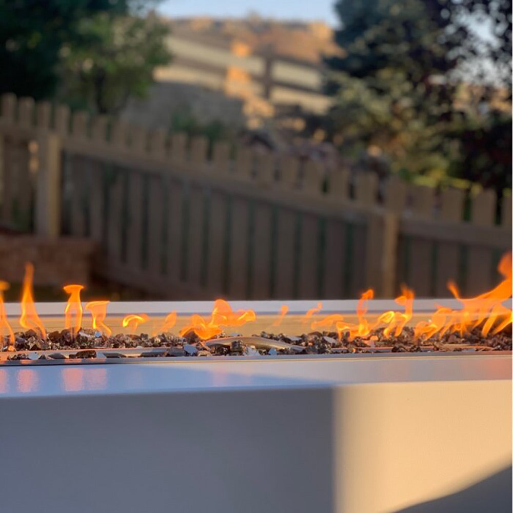 Close-up of flames in rectangular burner of a linear gas fire pit