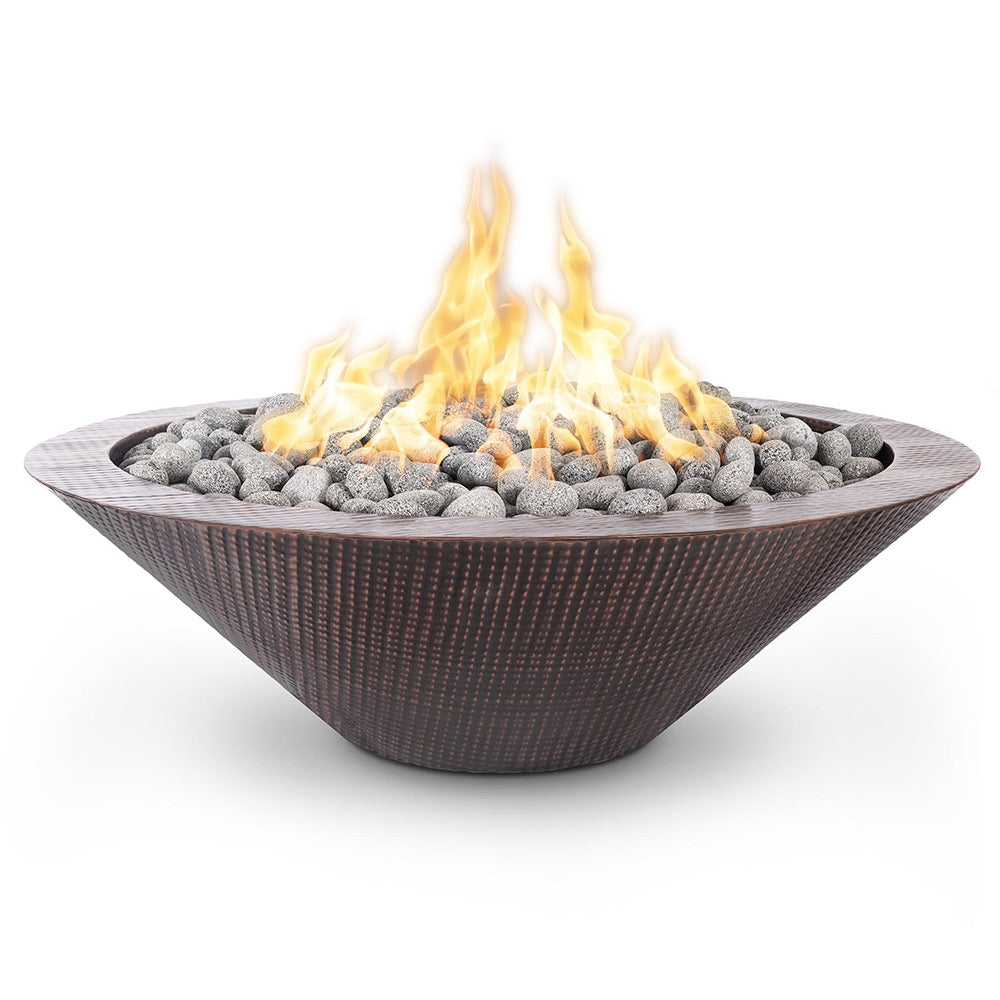 Round copper gas fire pit with flame and gray lava rocks