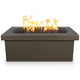 Dark gray linear concrete gas fire pit with flames and black fire media