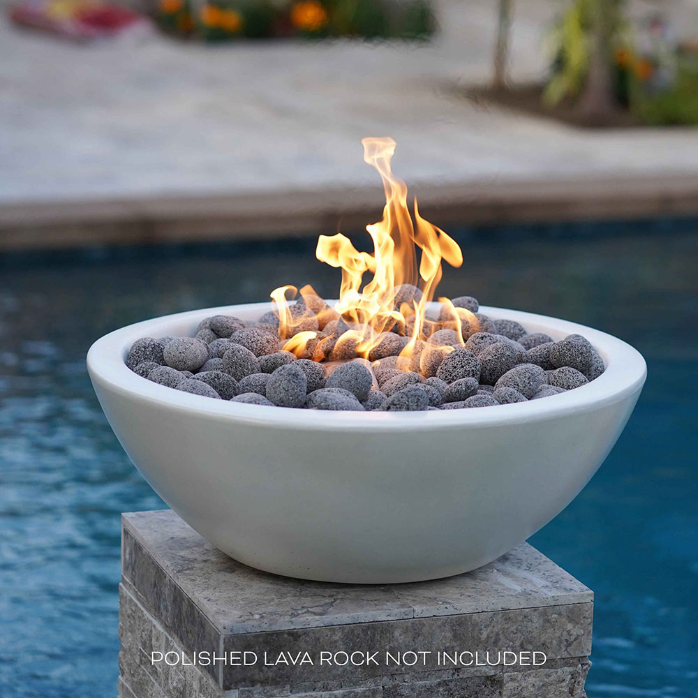 Round concrete gas fire pit, light gray bowl with flame and gray lava rocks.