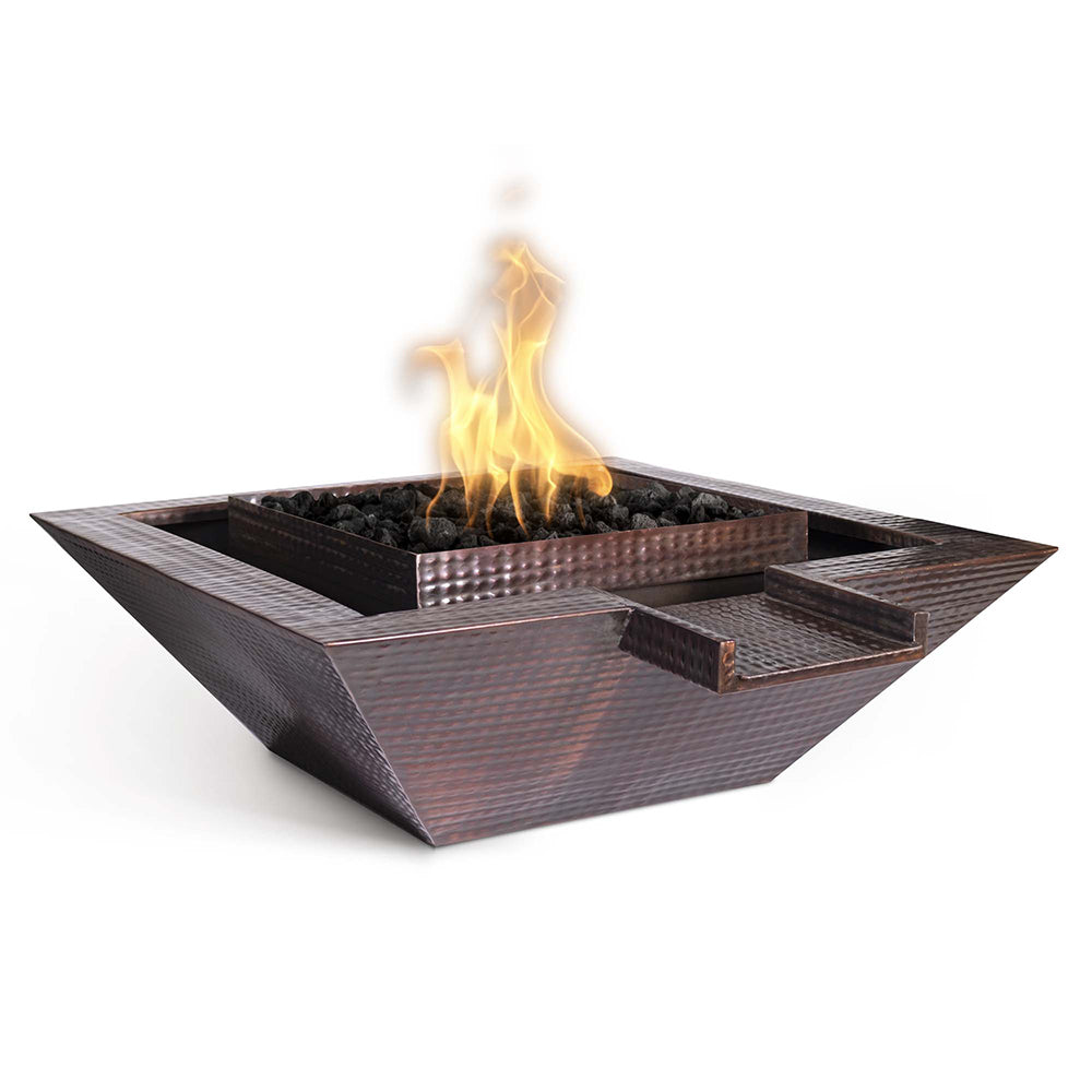Square copper gas fire bowl with flames in black firebed and open top