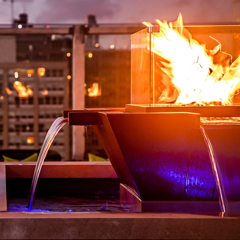 Copper square gas fire bowl with multiple water jets and bright flames
