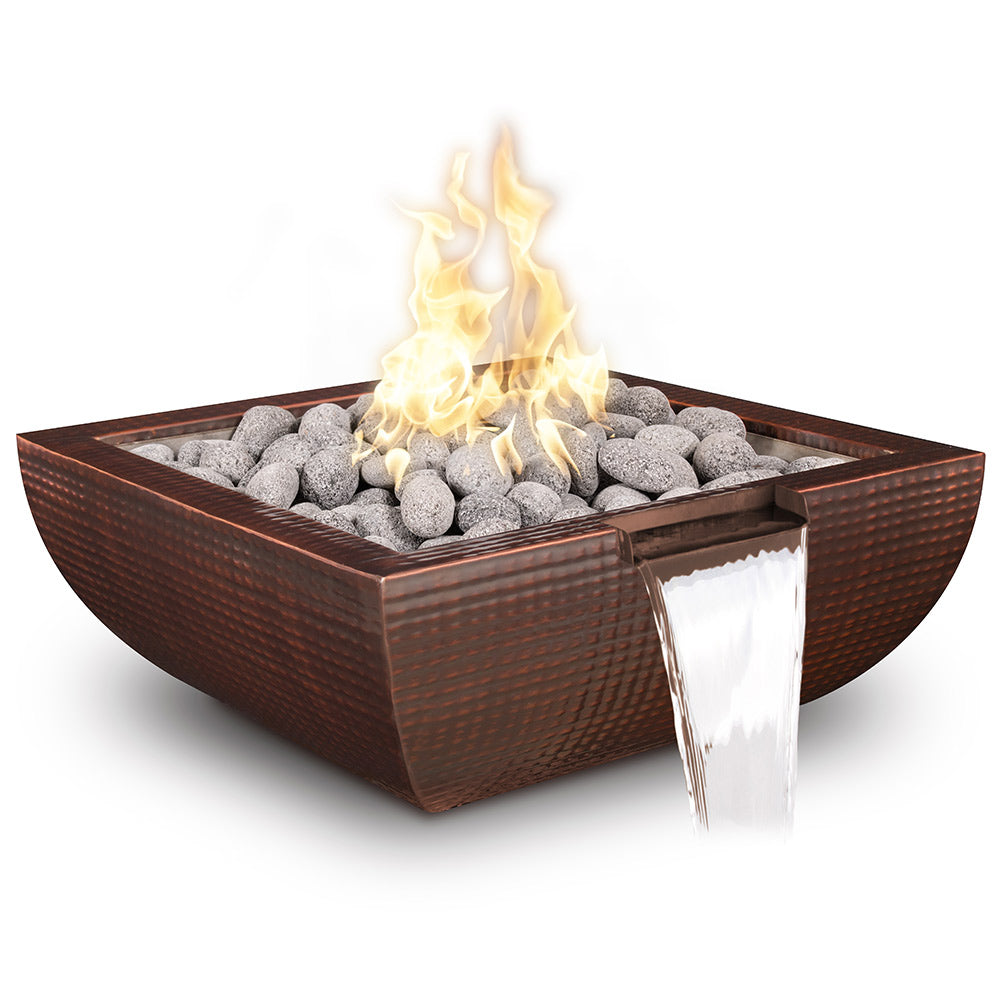 Copper square gas fire bowl with flames, grey fire rocks, and water stream