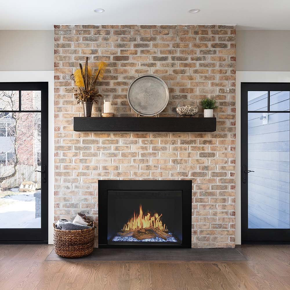 Electric fireplace insert with flames and blue ember bed, black trim