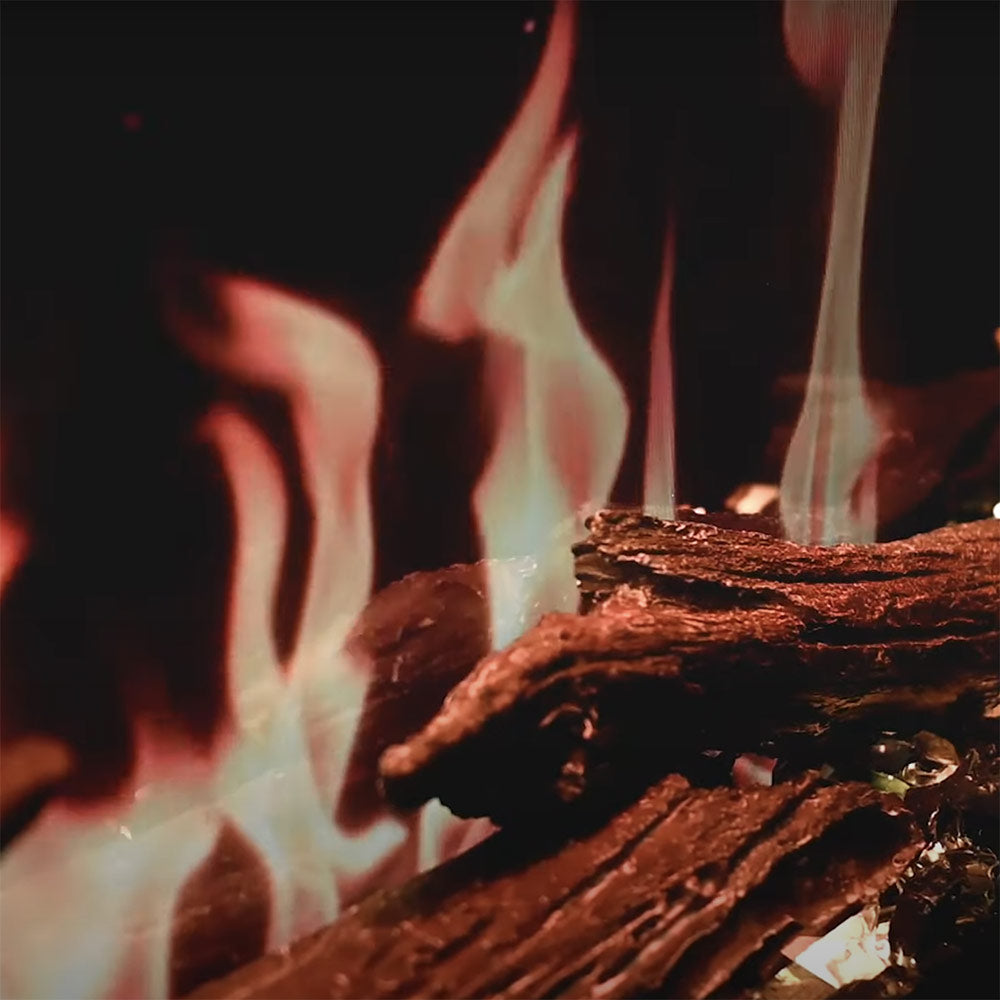 Electric fireplace flame effect with burning logs and warm orange flame detail
