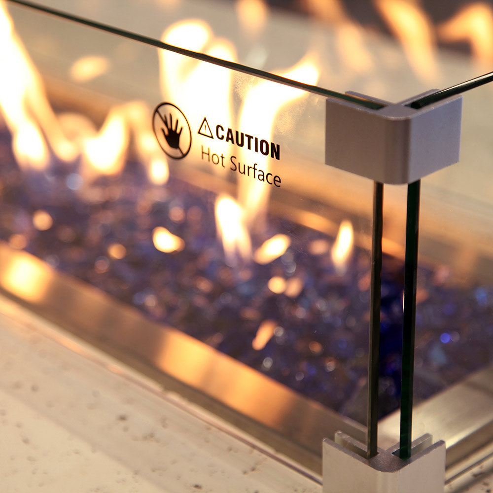 Propane fire pit safety label reading Caution Hot Surface on metal side panel
