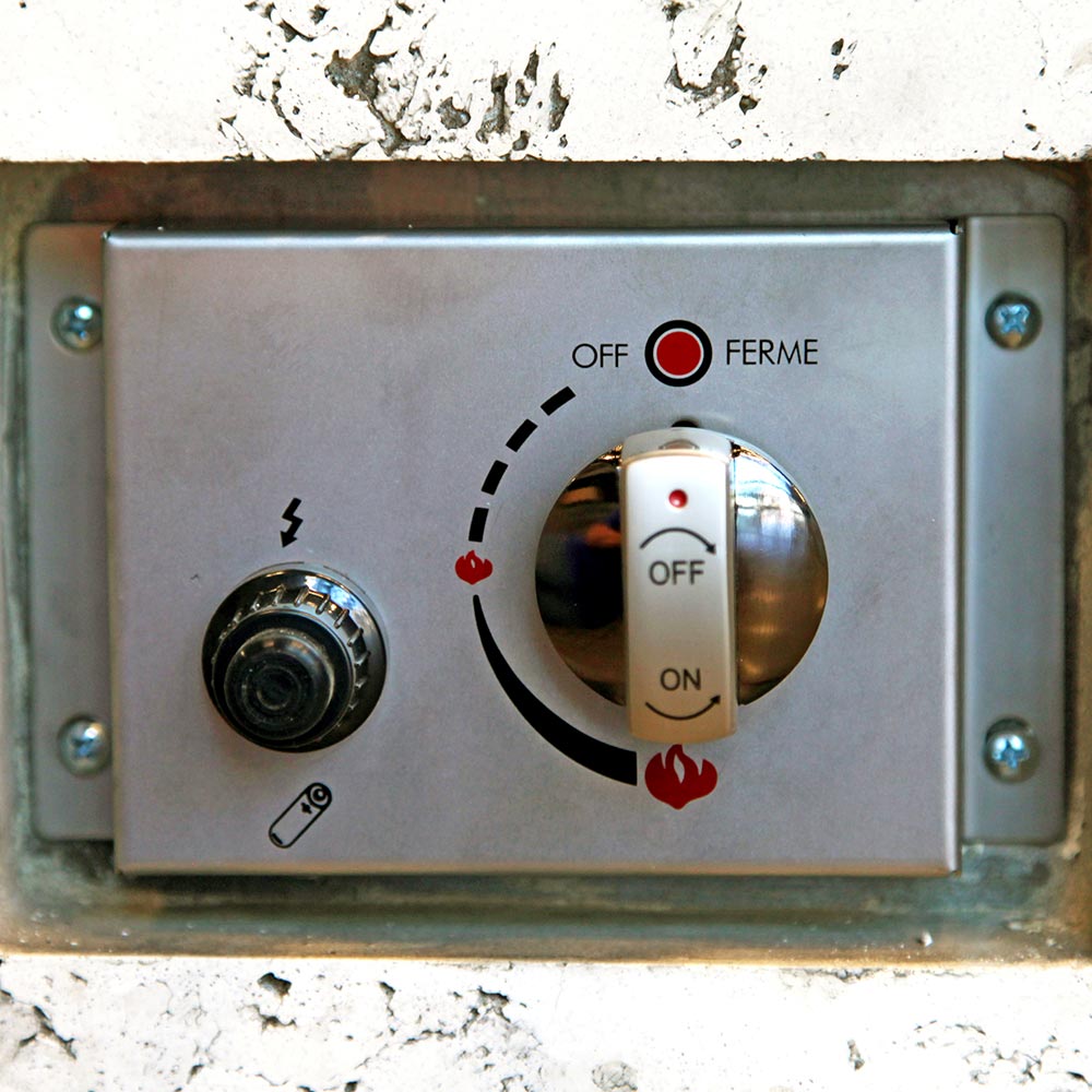 Fire pit ignition control switch panel with OFF and ON markings