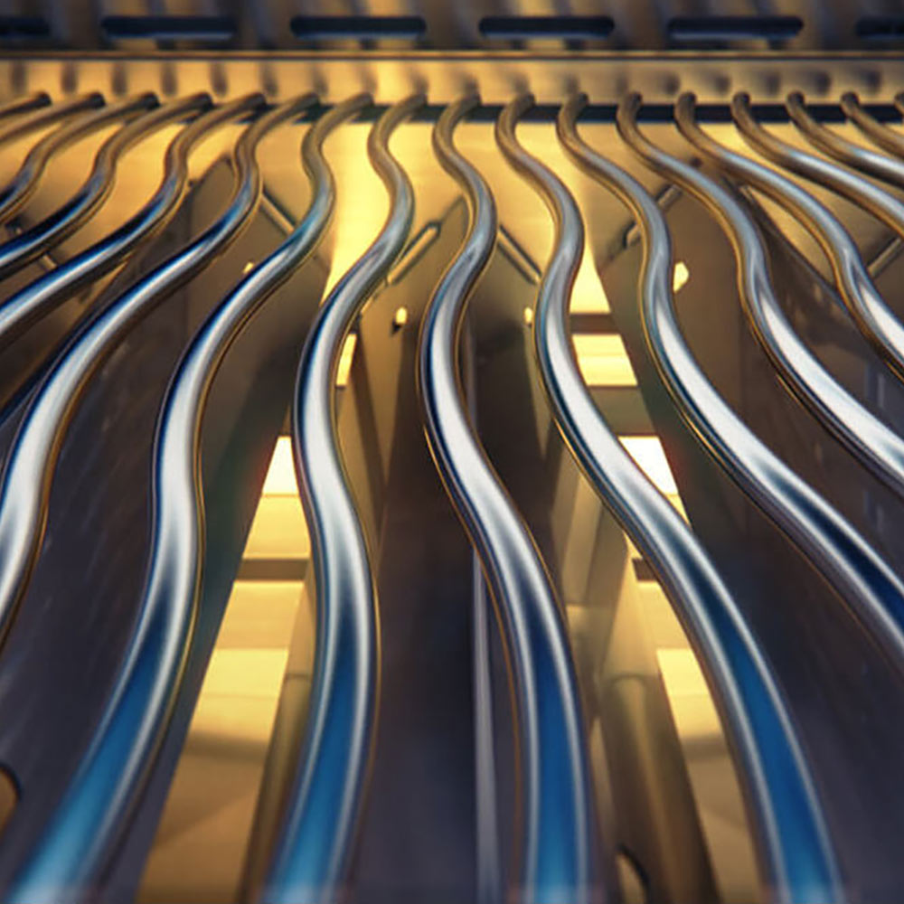 Gas grill burner tubes with heat glow under the cooking grate