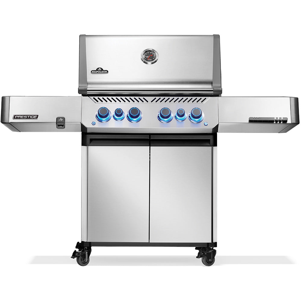 Stainless steel gas grill on cart with control knobs and side shelves, front view