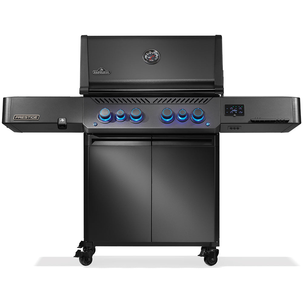 Black gas grill on cart with lid and blue-lit control knobs