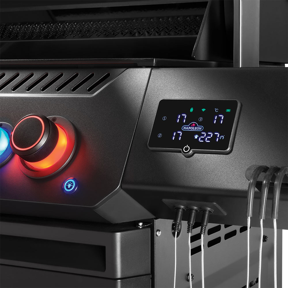 Black grill control panel with digital display and illuminated burner knobs