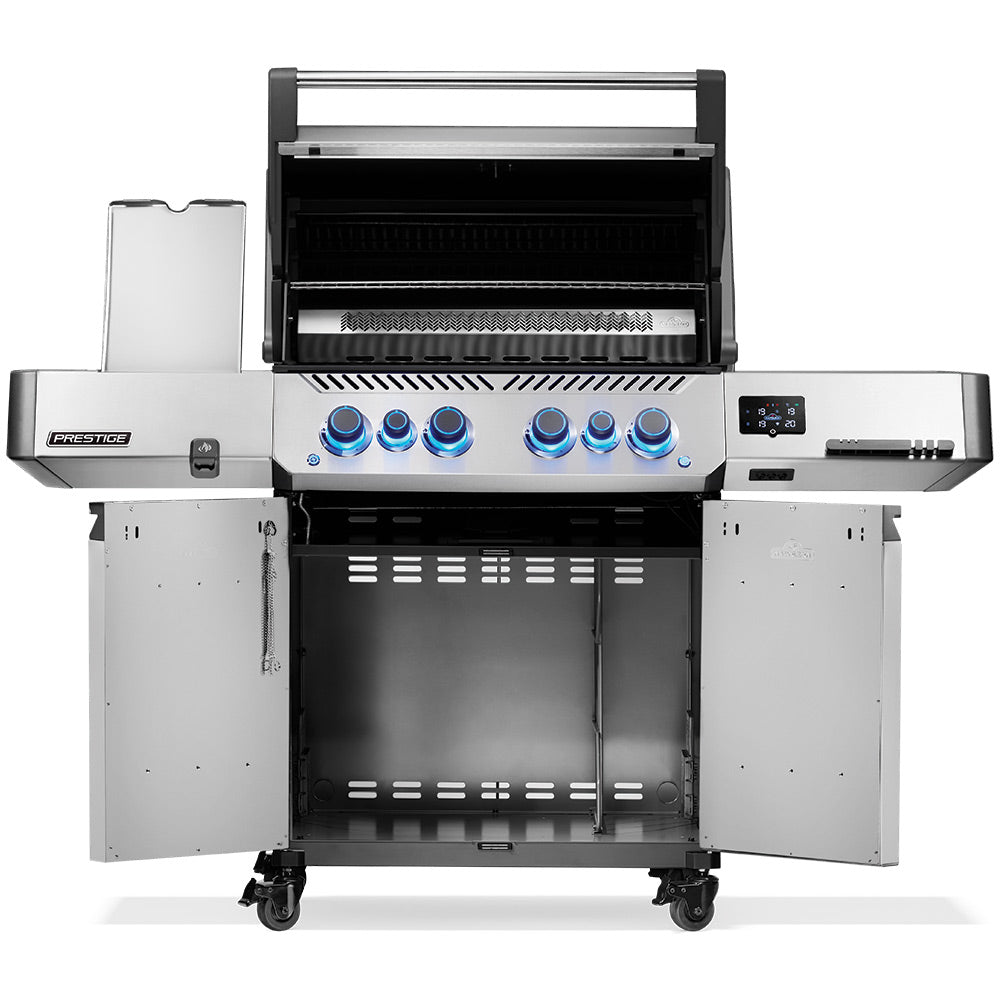 Open stainless gas grill with cooking grates visible, blue knobs, and side shelves