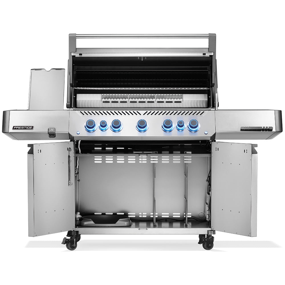 Open stainless steel gas grill showing cooking grates, warming area, and burners
