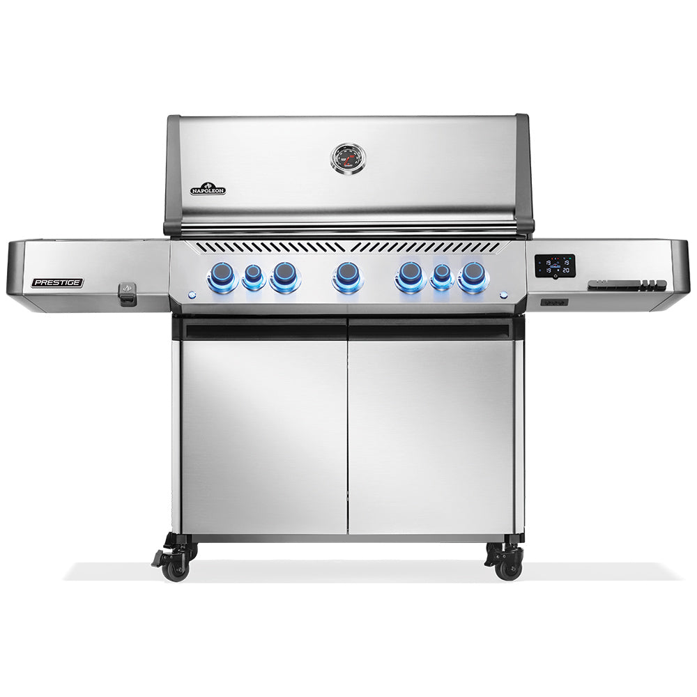 Stainless gas grill with control knobs and side shelves on a wheeled cart.
