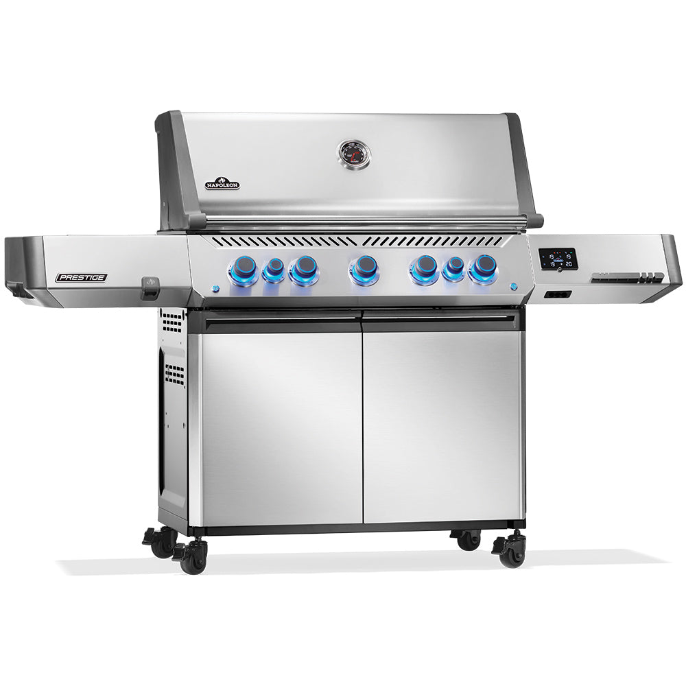 Stainless gas grill on wheeled cart with blue control knobs and side shelf.