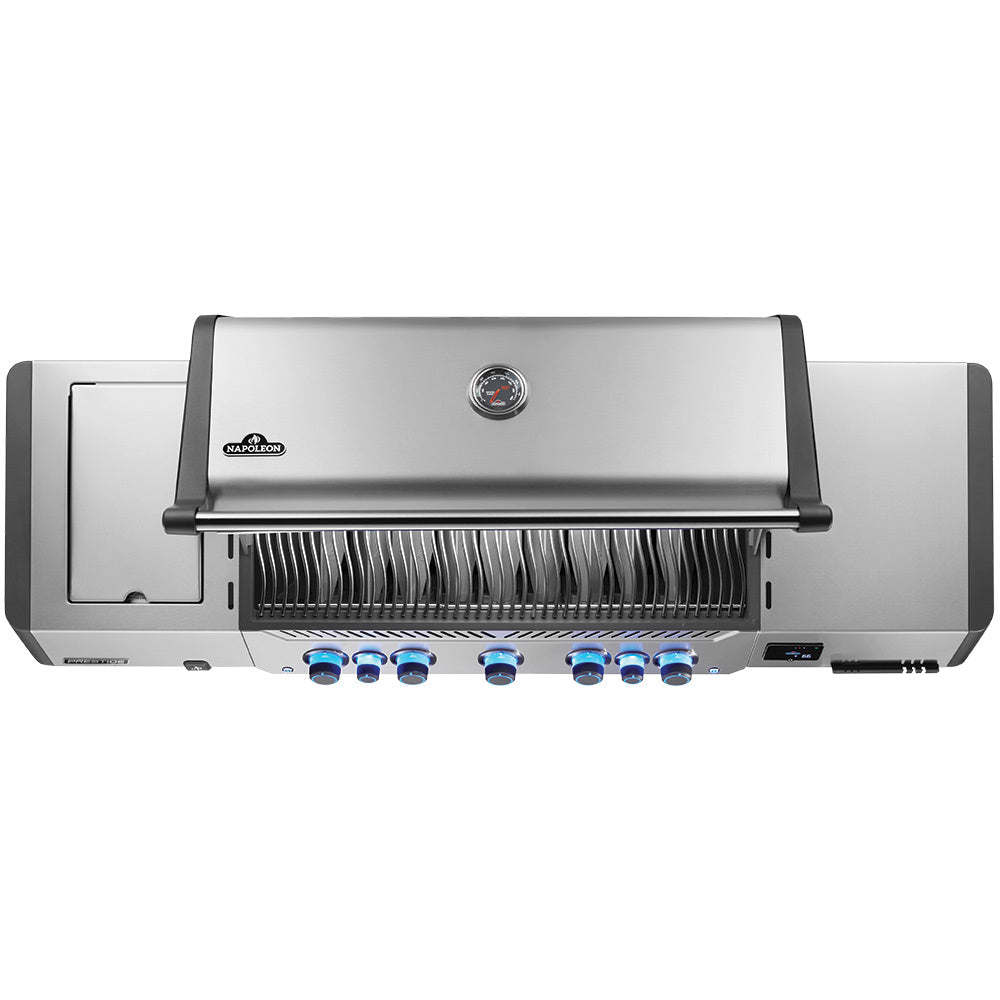 Stainless gas grill front control panel with blue knob dials and burner cover.