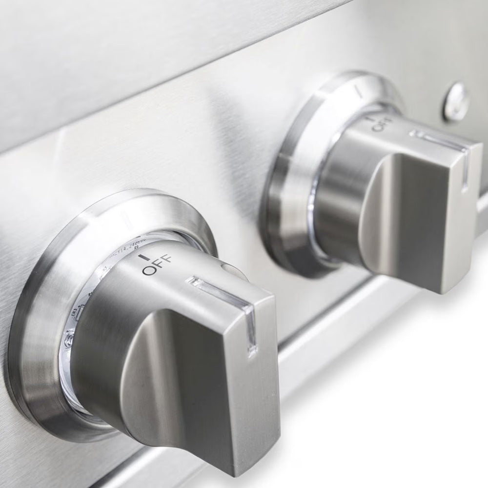 Stainless control knobs with OFF markings on a gas burner control panel