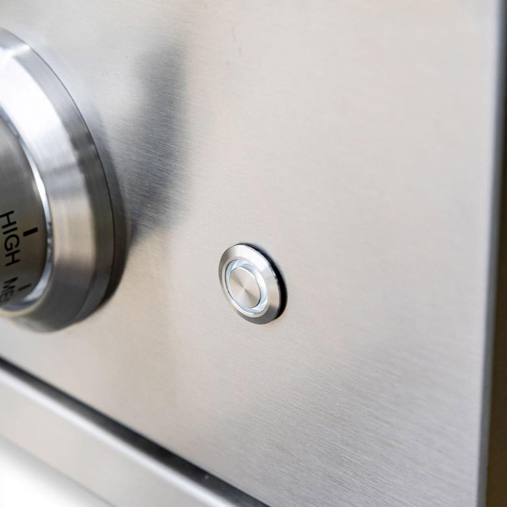 Stainless ignition or control button on the burner panel