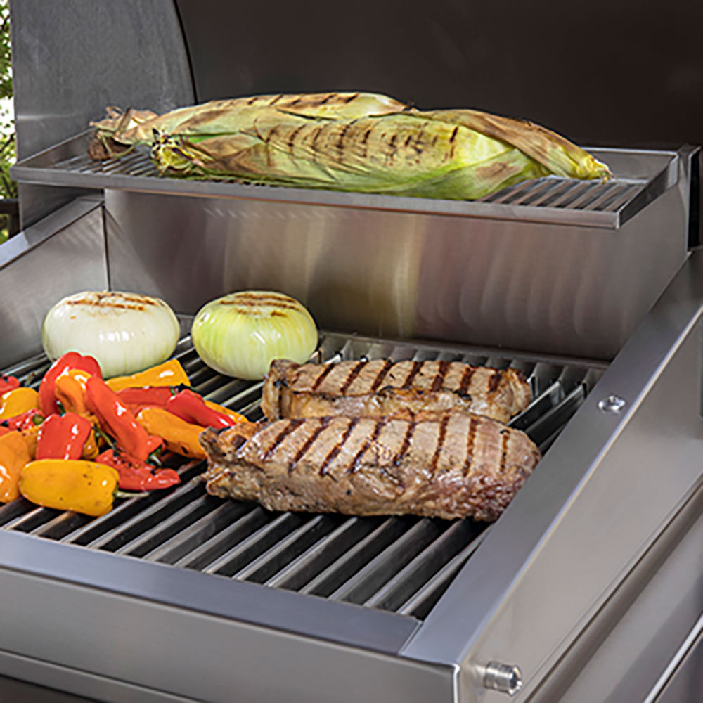 Stainless warming rack insert with parallel bars inside a grill.